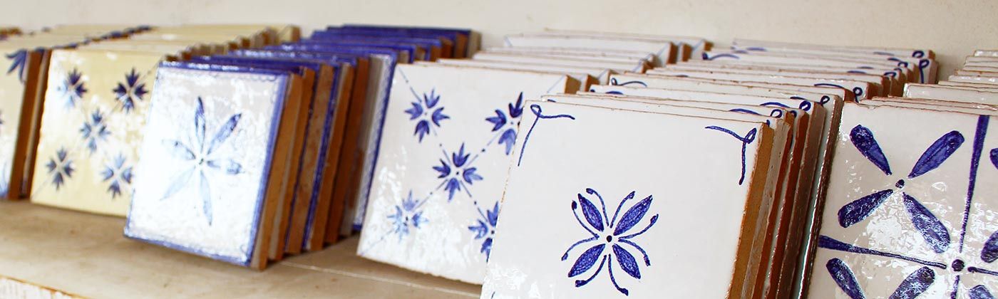 Hand painted terracotta wall tiles